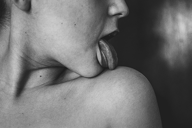 Girl Licking her shoulder